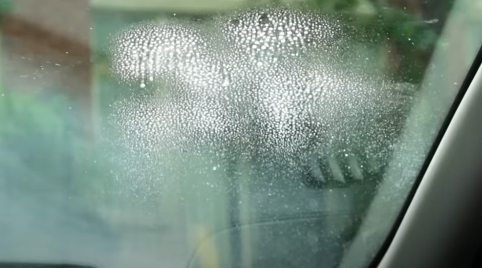 Window cleaner drops on the car's glass