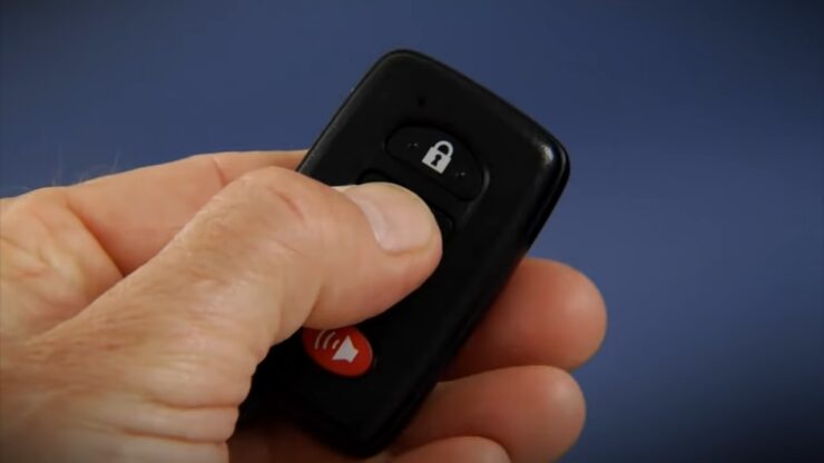 Hand holding Smart Key for Toyota Prius