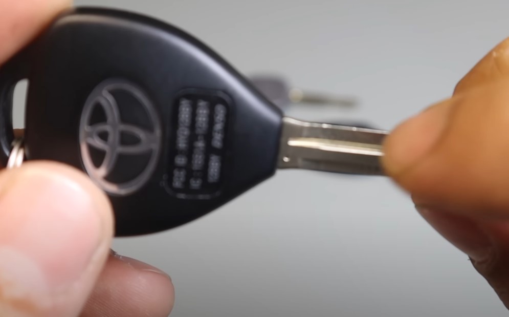 Man holds Toyota Camry key in his hands