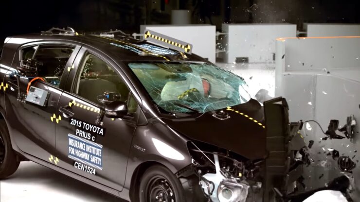 2015 Toyota Prius C undergoing a crash test conducted by the Insurance Institute for Highway Safety (IIHS).