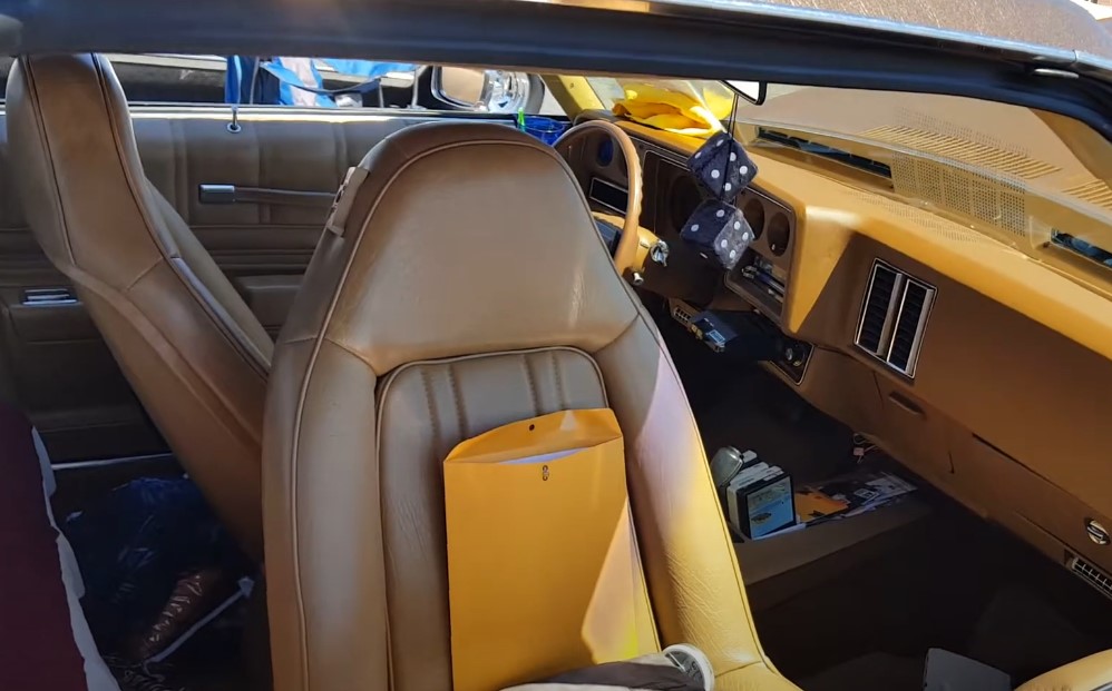 Yellow swivel bucket seats inside Monte Carlo