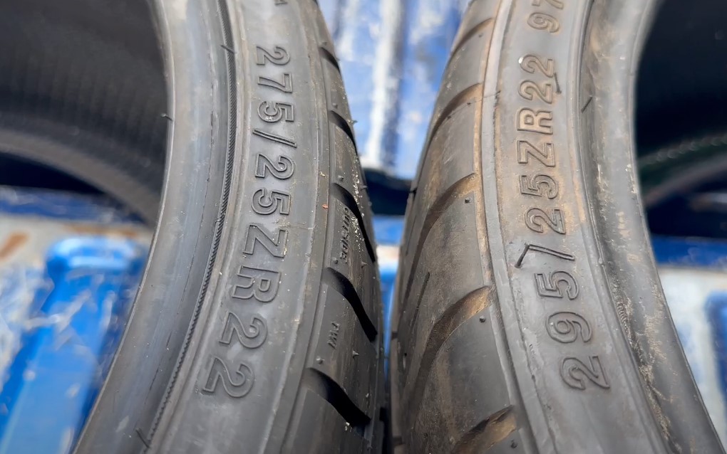 Close up photo of 275 tire on the left and 295 tire on the right