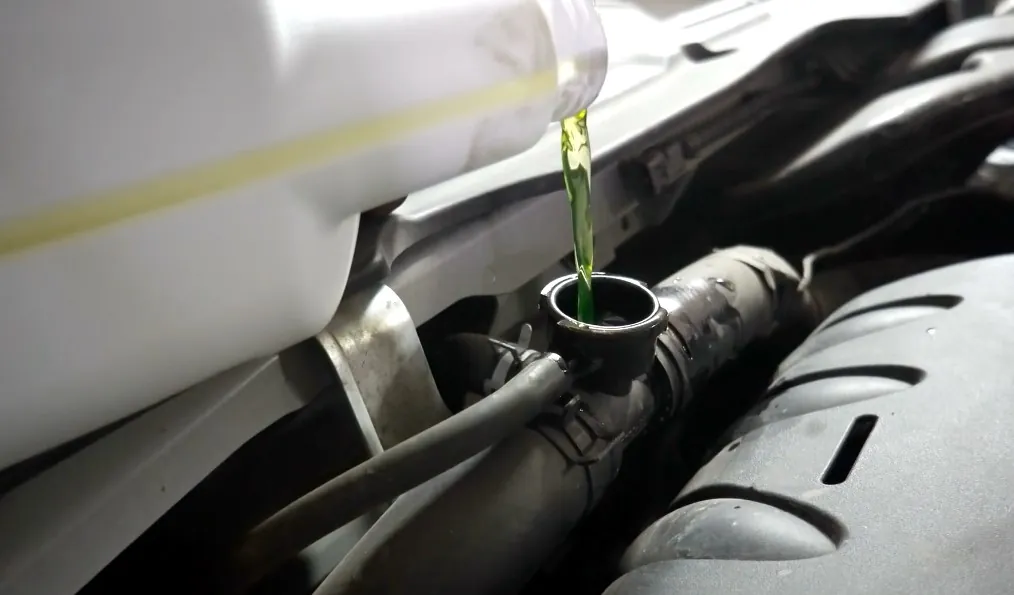 Sipping car coolant into an engine