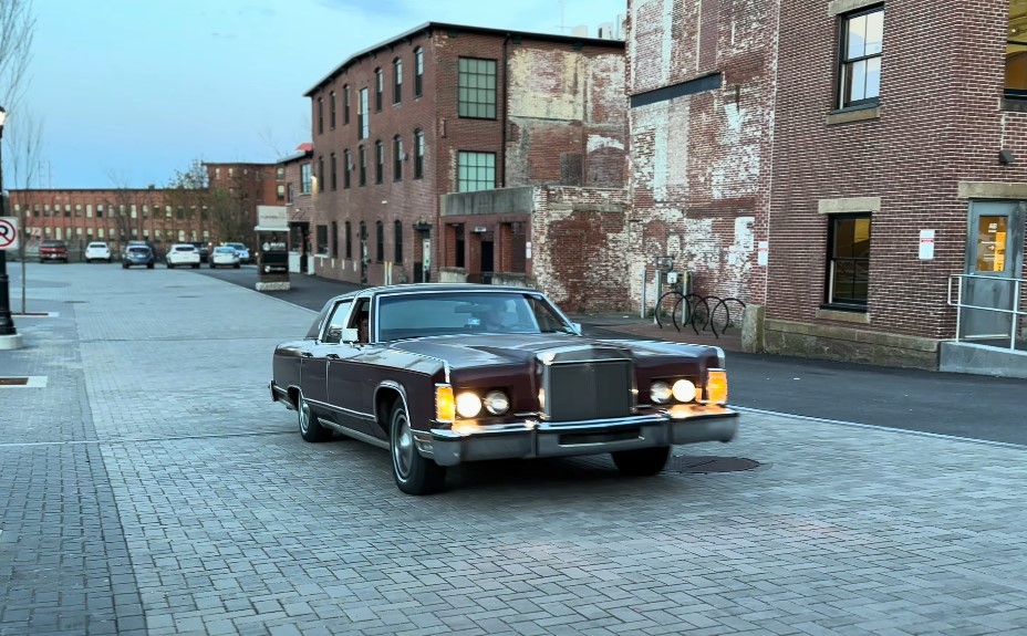 Red Continental Town Car on the road