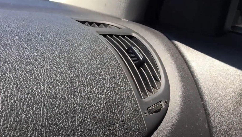 Air vent in front of the passenger seat in a car