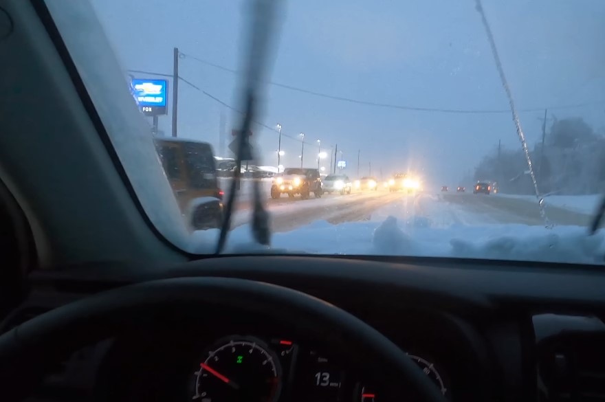 A look through car's window on a snowy road