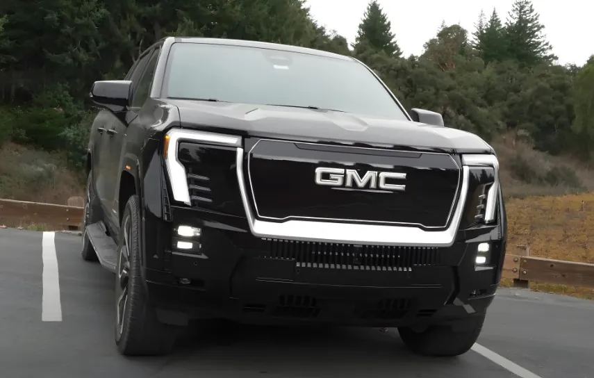 Black GMC Sierra EV truck on a parking spot