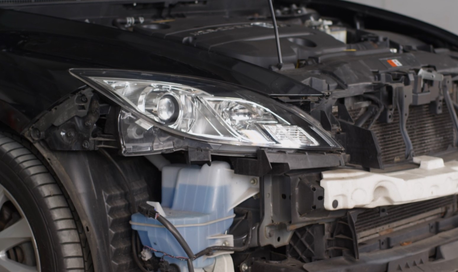 Close up photo of a car's engine under the hood