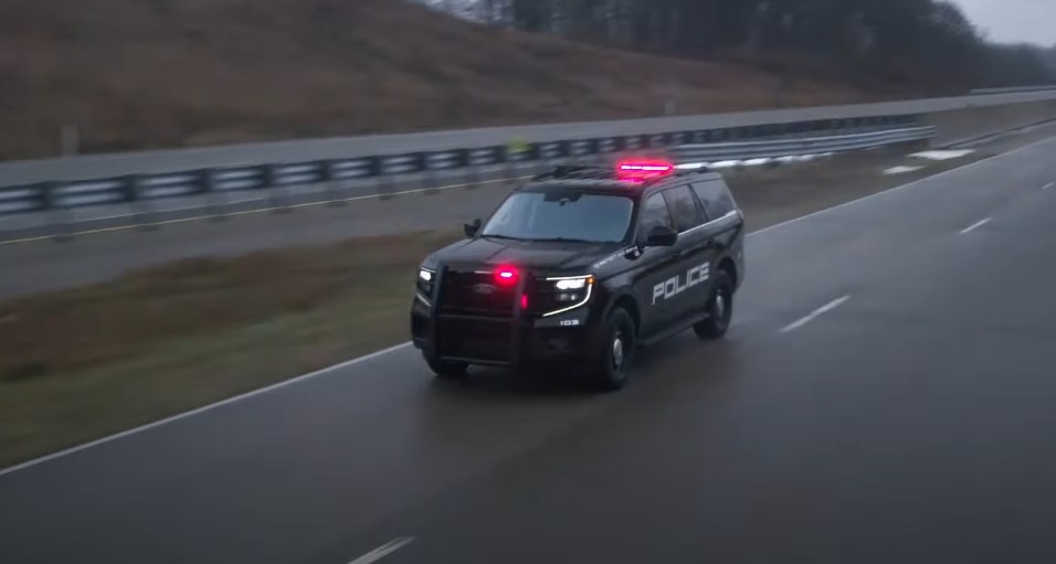 Expedition SUV police edition on a rainy road