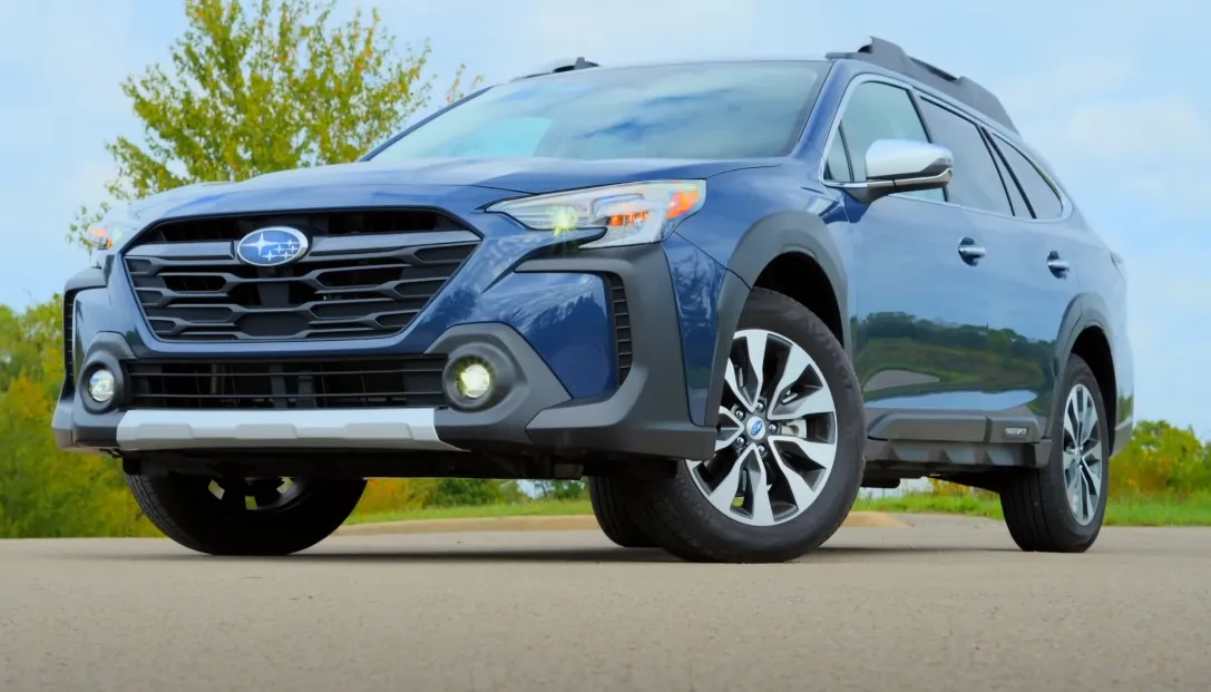 Dark-blue Subaru Outback SUV on the road