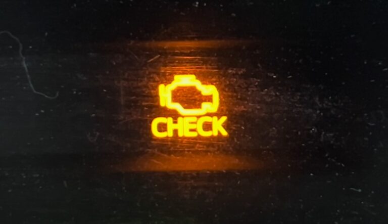 Close up photo of the check engine light warning