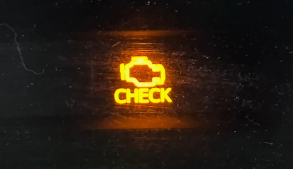 Close up photo of the check engine light warning