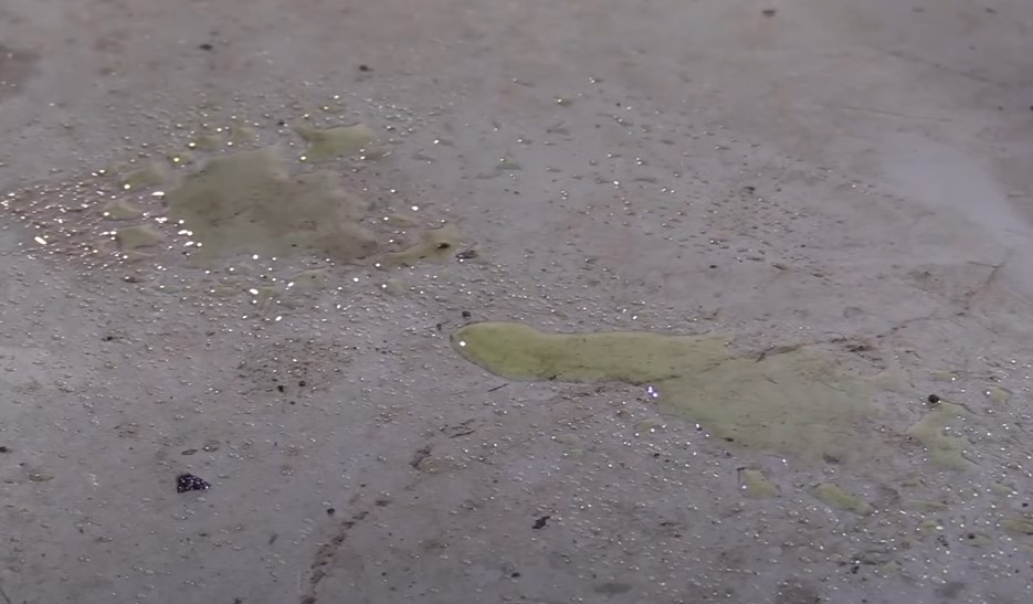 Green coolant leaking on asphalt