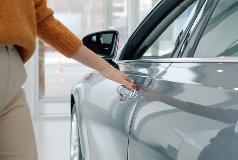 Woman opening car doors