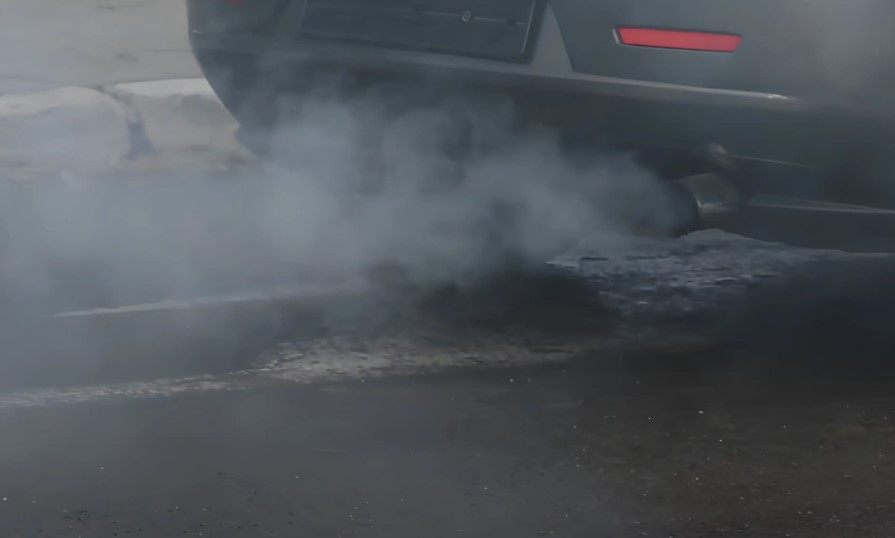 Smoke coming out of the car exhaust pipe