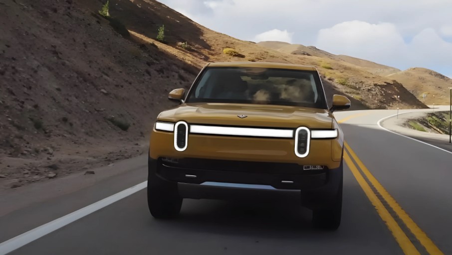 Yellow Rivian R1T truck on the road