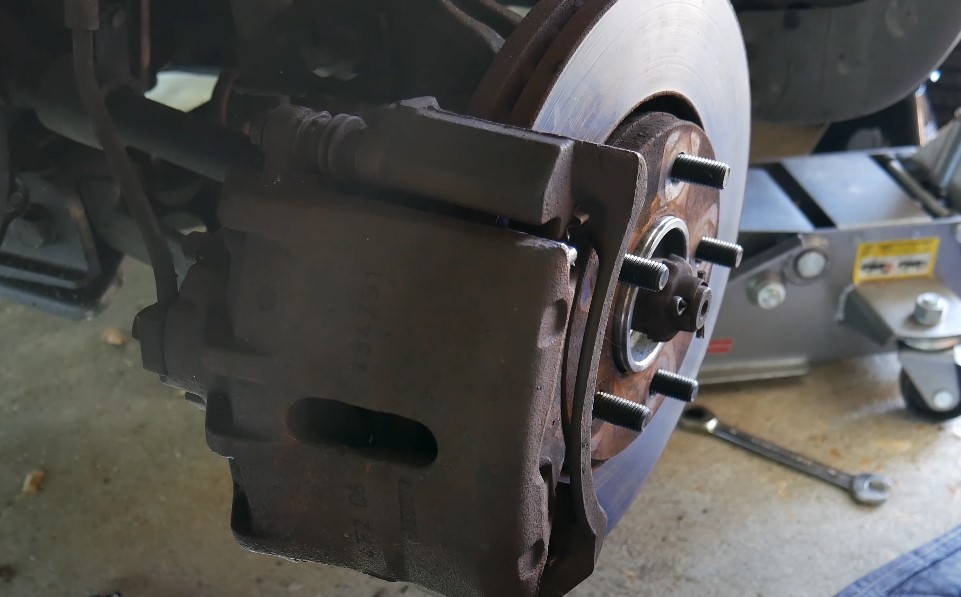 A close-up view of a vehicle's brake caliper and rotor