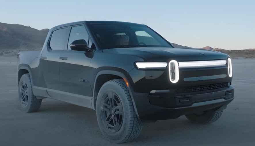 Black Rivian R1T truck in the dessert