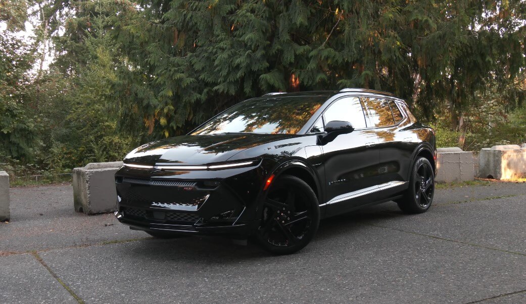 A black Chevy Equinox parked in a quiet spot