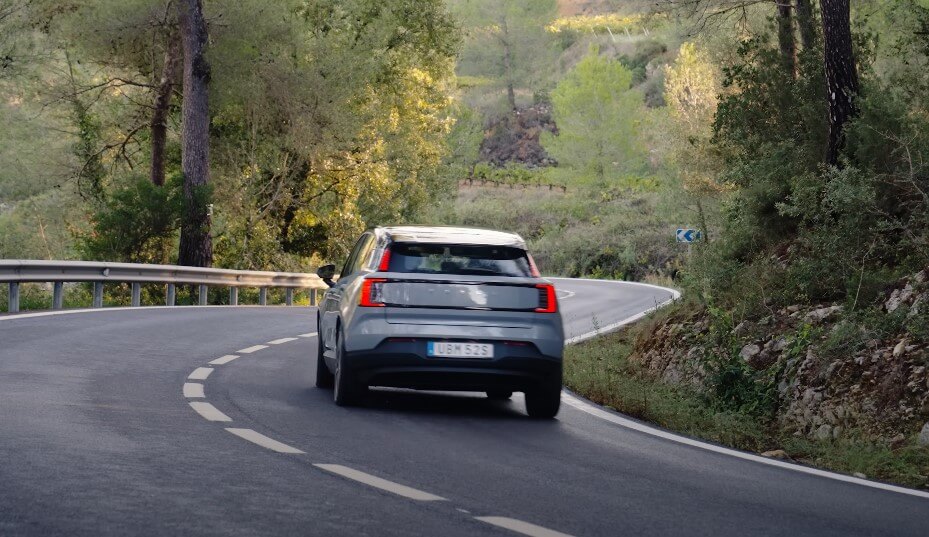 Volvo EX30 navigates a winding mountain road