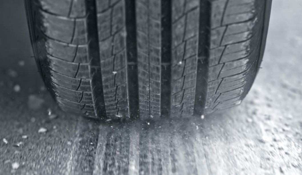 Close-up view of a tire tread on a snowy road