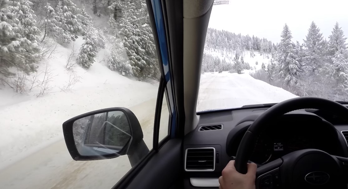 Driving through a snow-covered forest