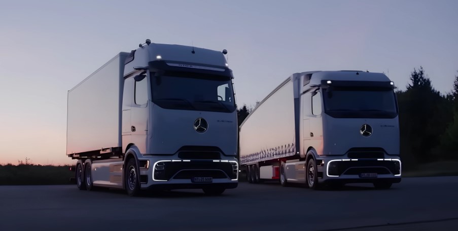 Powerful presence of two electric trucks during sunset