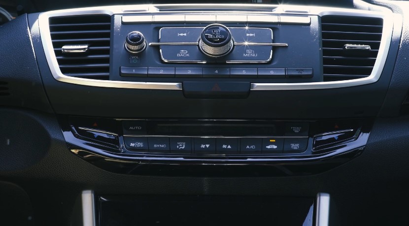 A close-up view of the car's infotainment and climate control panel