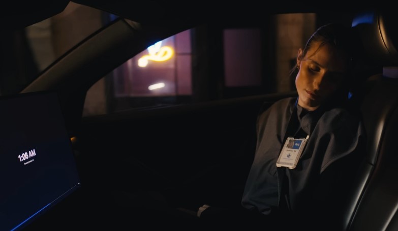 Late-night drive, a person dozes in the passenger seat
