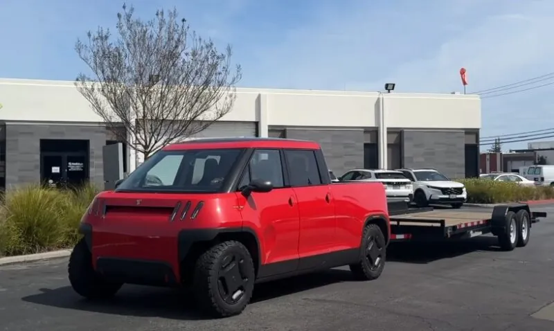 Red Telo MT1 pickup towing a trailer
