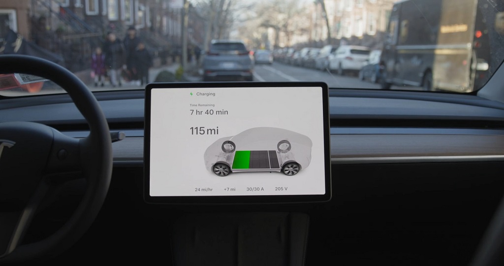 Tesla dashboard display showing charging progress after recovering from a dead battery
