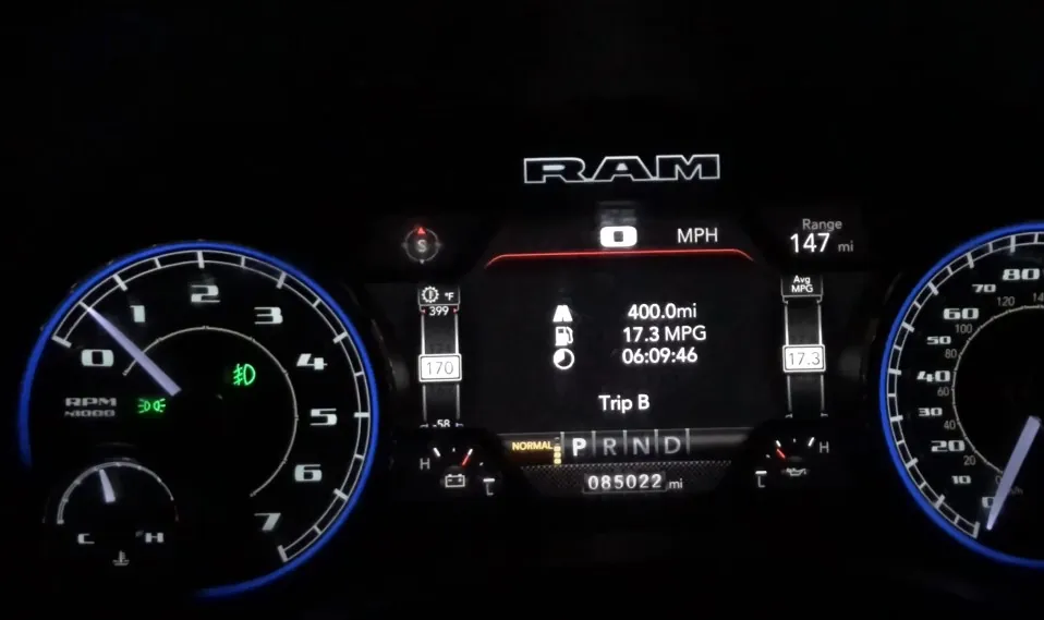 A RAM truck dashboard, showing current mileage, range, and fuel efficiency