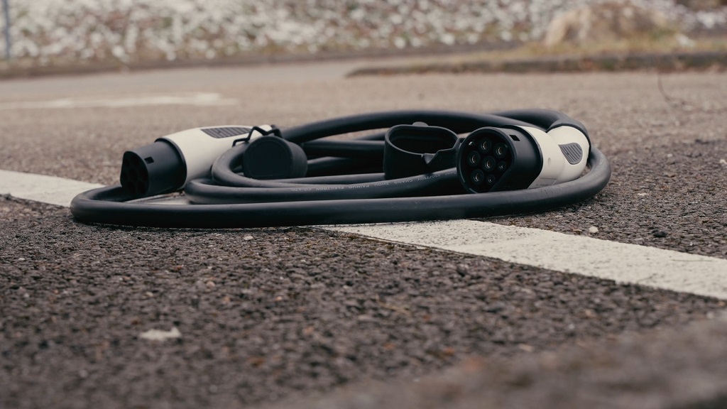 EV charging cable lying on the ground