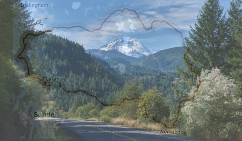 Scenic mountain highway with a transparent map overlay of the Cascade Loop route in Washington State