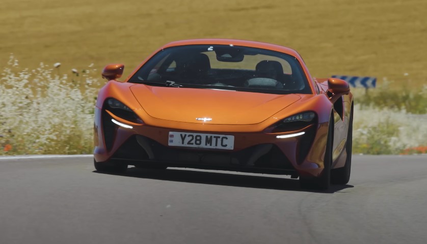 Orange McLaren Artura Evo on the road