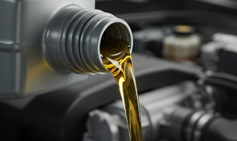 Close-up view of oil pouring into an engine