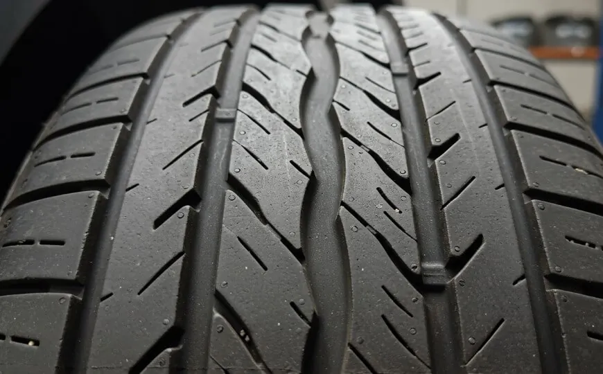 Close-up view of a tire tread, showcasing intricate patterns and deep grooves