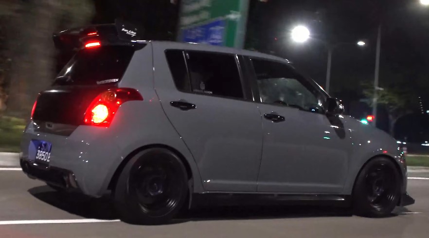 Sporty gray Suzuki Swift Sport Mk1 on a night drive