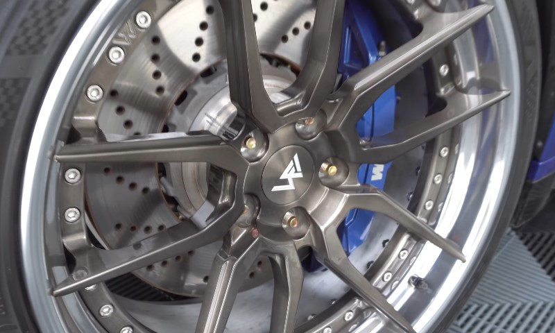Close up shot of a bolt pattern on a sporty wheel