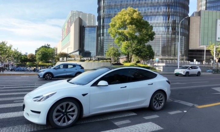 White electric vehicle parked on a street
