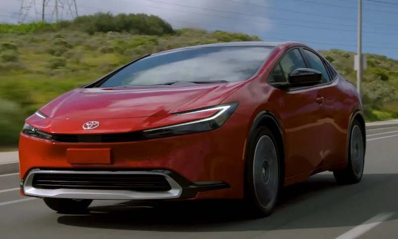 Electric red Toyota Prius on the road
